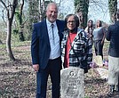 Latter-day Saints Church Branch President Kerry Petersen and Margaret “Tina” Webb stand at the tomb of her grandfather, WWII veteran John Robert Webb, with relatives Shara Khon and Mary Duncan in the background at Dorothy E. Ball’s tombstone.