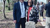 Latter-day Saints Church Branch President Kerry Petersen and Margaret “Tina” Webb stand at the tomb of her grandfather, WWII veteran John Robert Webb, with relatives Shara Khon and Mary Duncan in the background at Dorothy E. Ball’s tombstone.