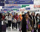 Travelers walk through Terminal 3 at O’Hare International Airport Nov. 26 in Chicago.