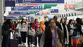 Travelers walk through Terminal 3 at O’Hare International Airport Nov. 26 in Chicago.