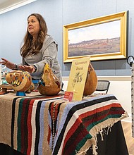 Deborah (Adams) Wilkinson sells a variety of handmade gourd items at the VMHC.