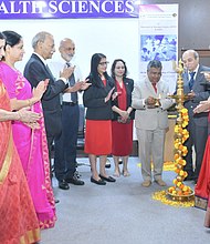 At right, Punitha Ezhilarasu, senior consultant to the Indian Nursing Council and former dean of the College of Nursing Christian Medical College Vellore. The colorful statue in the middle is a traditionally designed brass lamp.  Lighting a lamp during an inauguration is a symbolic ritual representing enlightenment, knowledge, and wisdom