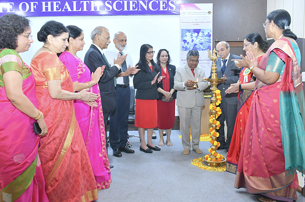 At right, Punitha Ezhilarasu, senior consultant to the Indian Nursing Council and former dean of the College of Nursing Christian Medical College Vellore. The colorful statue in the middle is a traditionally designed brass lamp.  Lighting a lamp during an inauguration is a symbolic ritual representing enlightenment, knowledge, and wisdom