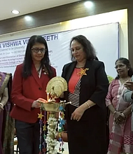 At right, Punitha Ezhilarasu, senior consultant to the Indian Nursing Council and former dean of the College of Nursing Christian Medical College Vellore. The colorful statue in the middle is a traditionally designed brass lamp.  Lighting a lamp during an inauguration is a symbolic ritual representing enlightenment, knowledge, and wisdom.