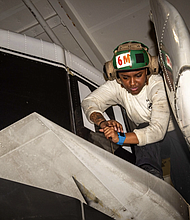 Aviation Structural Mechanic Airman Genelle Green, of Houston, Texas
PACIFIC OCEAN
Photo by Seaman Kenneth Ostas 
USS Carl Vinson