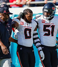 Houston Texans linebacker Azeez Al-Shaair (No. 0) was escorted off the field after being ejected from Sunday's game against the Jacksonville Jaguars
Mandatory Credit:	David Rosenblum/Icon Sportswire/Getty Images via CNN Newsource