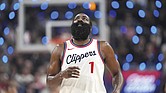 Los Angeles Clippers guard James Harden looks toward the scoreboard after making a three-point shot that put him at 2,998 points for three-point shots during the first half of a game against the Denver Nuggets, Sunday, Dec. 1.