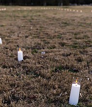 During the Shockoe Project Celebration at Ancarrow’s Landing, plans were unveiled for a 12-foot bronze sculpture to commemorate the arrival point of enslaved people on the banks of the James River. Battery-powered candles symbolized the sculpture’s future placement.