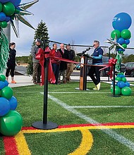 Jessica Schneider, Clover Hill District Supervisor, addresses the crowd at the ribbon-cutting ceremony for the four new lighted turf fields at River City Sportsplex.