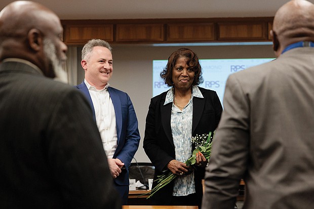 Outgoing 8th District School Board Member and Chairwoman, Dawn Page, (right) with Richmond Public School Superintendent Jason Kamras (left) hears gratitude from family members and former School Board colleagues for her 12 years of service.