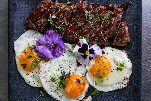 Lavish Eats HTX catering offers elegant holiday brunch dishes like Steak & Eggs/Photo: Visual Influence