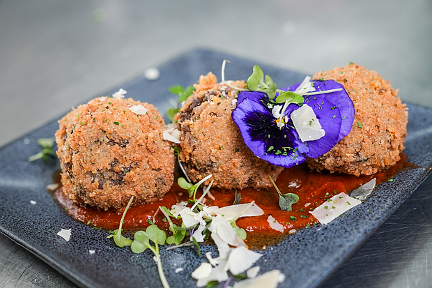 Lavish Eats HTX catering offers gourmet platters of distinctive appetizers like Arancini (Wagyu beef cheesy risotto balls filled with fresh mozzarella and served with zesty marinara)./Photo: Visual Influence
