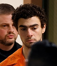 Luigi Mangione is escorted from the Blair County Court House in Hollidaysburg, Pennsylvania, after an extradition hearing on Tuesday.
Mandatory Credit:	Eduardo Munoz/Reuters via CNN Newsource