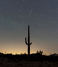 A meteor streaks through the night sky during the annual Geminid meteor shower in Lukeville, Arizona, in December 2023. The Geminids are expected to be most active between noon and 8 p.m. ET on December 13.
Mandatory Credit:	Go Nakamura/Reuters via CNN Newsource