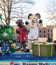 Mascots from the University of Richmond and Virginia Commonwealth University share a float.