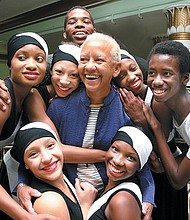 Nikki Giovanni poses with members of the City Dance Theatre during a reception before a program featuring the poet at the Landmark Theater in 2005.