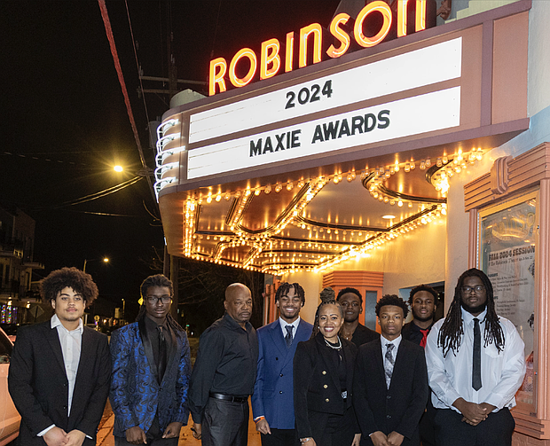 Thomas Jefferson High School staff and football players gather outside the Robinson Theater Community Arts Center for the 2024 Maxie Awards Banquet.