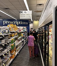 Customers wait to pick up prescriptions at a Walgreens pharmacy in Queens, New York, in July 2024. Walgreens’ stock has plunged more than 80% over the past five years.
Mandatory Credit:	Lindsey Nicholson/UCG/Universal Images Group/Getty Images via CNN Newsource