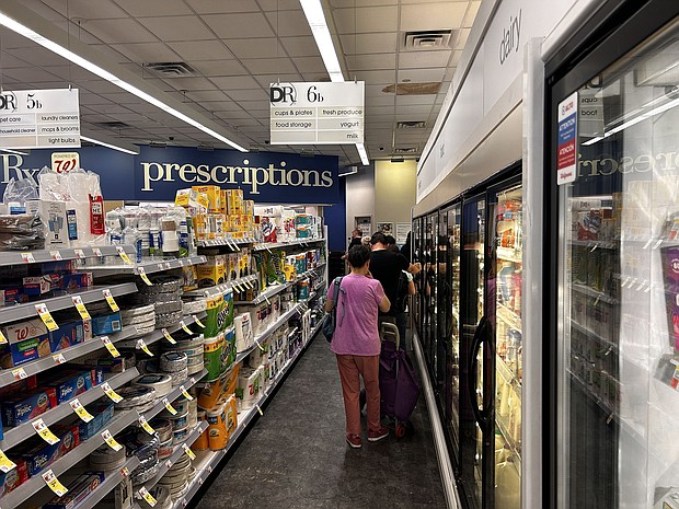 Customers wait to pick up prescriptions at a Walgreens pharmacy in Queens, New York, in July 2024. Walgreens’ stock has plunged more than 80% over the past five years.
Mandatory Credit:	Lindsey Nicholson/UCG/Universal Images Group/Getty Images via CNN Newsource