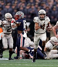 Then-Army quarterback Christian Anderson runs for a touchdown against Navy during the first half of the Army-Navy game in December 2021.
Mandatory Credit:	Adam Hunger/AP via CNN Newsource