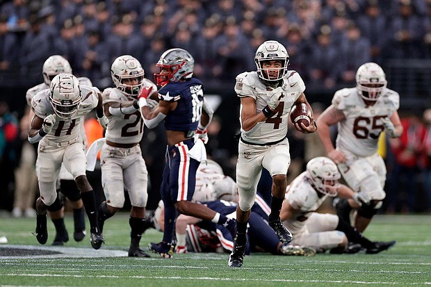 Then-Army quarterback Christian Anderson runs for a touchdown against Navy during the first half of the Army-Navy game in December 2021.
Mandatory Credit:	Adam Hunger/AP via CNN Newsource