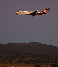 A Hawaiian Airlines flight approaches Ellison Onizuka Kona International Airport at Keahole on the island of Hawaii on January 18, 2024. A 2022 incident of turbulence aboard a Hawaiian Airlines flight injured dozens.
Mandatory Credit:	Kevin Carter/Getty Images/File via CNN Newsource