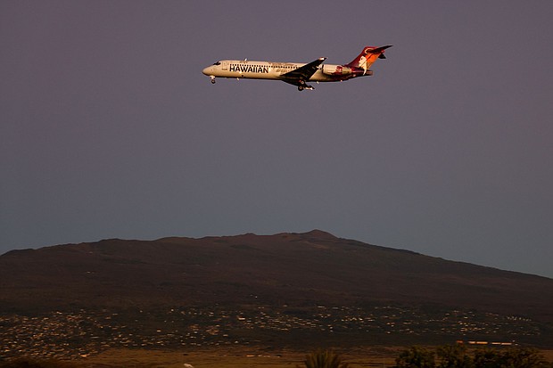 A Hawaiian Airlines flight approaches Ellison Onizuka Kona International Airport at Keahole on the island of Hawaii on January 18, 2024. A 2022 incident of turbulence aboard a Hawaiian Airlines flight injured dozens.
Mandatory Credit:	Kevin Carter/Getty Images/File via CNN Newsource