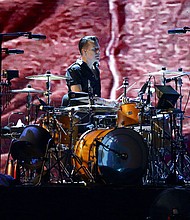 Larry Mullen Jr. of U2 performs at the National Stadium in Singapore on November 30, 2019.
Mandatory Credit:	Suhaimi Abdullah/Getty Images via CNN Newsource