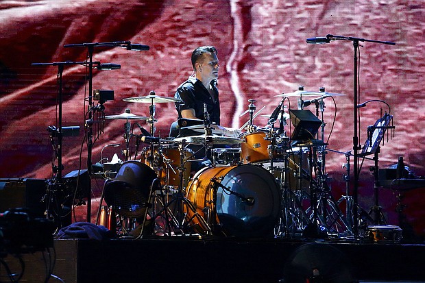 Larry Mullen Jr. of U2 performs at the National Stadium in Singapore on November 30, 2019.
Mandatory Credit:	Suhaimi Abdullah/Getty Images via CNN Newsource