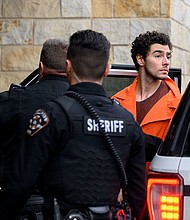 Luigi Mangione is led into the Blair County Courthouse for an extradition hearing on Tuesday in Hollidaysburg, Pennsylvania.
Mandatory Credit:	Jeff Swensen/Getty Images via CNN Newsource