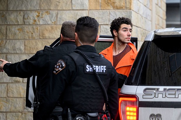 Luigi Mangione is led into the Blair County Courthouse for an extradition hearing on Tuesday in Hollidaysburg, Pennsylvania.
Mandatory Credit:	Jeff Swensen/Getty Images via CNN Newsource