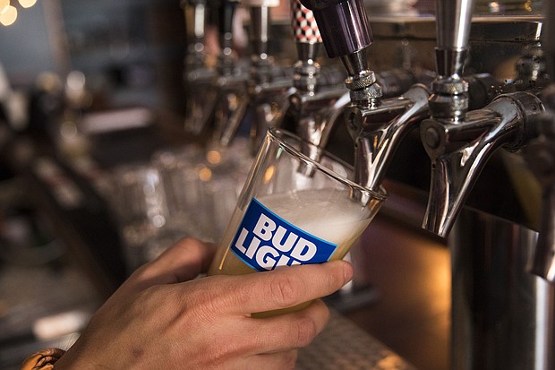 A bartender pours a Bud Light from a tap.
Mandatory Credit:	Drew Angerer/Getty Images/File via CNN Newsource