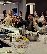 Celeb Chef Chris Shepherd showing his skills before a group at the Experience and Design Center in Houston.