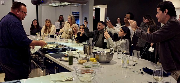 Celeb Chef Chris Shepherd showing his skills before a group at the Experience and Design Center in Houston.