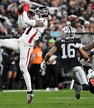 Atlanta Falcons safety Justin Simmons intercepts a pass in the second half against the Las Vegas Raiders.
Mandatory Credit:	David Becker/AP via CNN Newsource