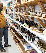 Oliver Saunders shops for gifts at the Bizarre Market at the Visual Arts Center of Richmond, open daily from 11 a.m. to 6 p.m. through Dec. 23, featuring handmade goods by local vendors.