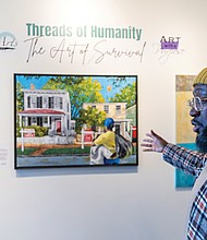 David Marion, visual artist and co-founder of the Liberated Arts Foundation, discusses one of his pieces in the pop-up exhibition “Threads of Humanity: The Art of Survival” at the Black History Museum & Cultural Center of Virginia. Curated by Marion and his wife, Tiara Green, the exhibit focuses on homelessness, with a portion of art sales supporting organizations that aid unhoused individuals.