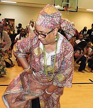 A performer showcases traditional African dance during a recent Richmond Kwanzaa Afrikan Heritage Celebration. This year’s event, themed “Together We Win!,” will feature drums, dance and cultural activities at Martin Luther King Jr. Middle School on Dec. 27.