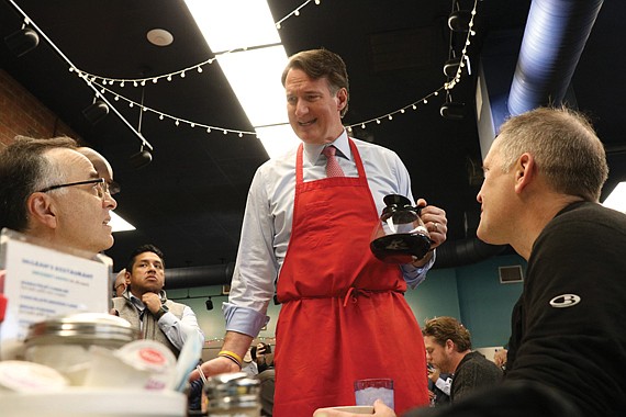 Gov. Glenn Youngkin serves coffee to patrons at McLean’s Restaurant Dec. 16
after announcing a “no-tax-on-tips” budget proposal.