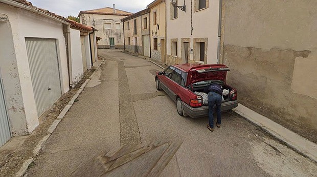 A Google Maps image showing a man leaning over the trunk of a car in Tajueco, Spain.
Mandatory Credit:	Google Maps via CNN Newsource