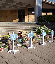 A makeshift memorial is set up on the steps of the Old National Bank, site of the April 10, 2023, shooting in Louisville, Kentucky. The five people killed by suspected gunman Connor Sturgeon, a 25-year-old bank employee, were among the 458 people killed on the job in the United States in 2023.
Mandatory Credit:	Leandro Lozada/AFP/Getty Images/File via CNN Newsource