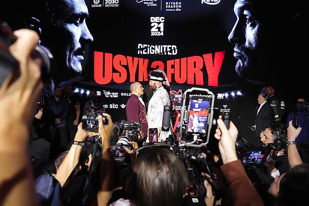Oleksandr Usyk and Tyson Fury face off during a press conference in Riyadh, Saudi Arabia.
Mandatory Credit:	Nick Potts/PA Images/Getty Images via CNN Newsource