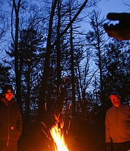 Folks gather around a fire during a winter solstice celebration in North Andover, Massachusetts, on December 21, 2021.
Mandatory Credit:	Reba Saldanha/Reuters via CNN Newsource