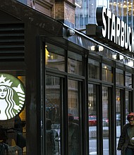 The Starbucks Workers United union started a strike in three cities - Seattle, Chicago and Los Angeles - on Friday, December 20.
Mandatory Credit:	Angus Mordant/Bloomberg via Getty Images via CNN Newsource