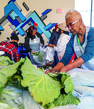Denise Lewis, of the Richmond Chapter of The Links, volunteers at the Holiday Harvest
Food Distribution event on Dec. 21 at Martin Luther King Jr. Middle School. The event,
which distributed food to local families, was hosted by Richmond Public Schools in
collaboration with Feed More and Lulus Local Food.