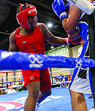 Nnajai Wright, a senior at Thomas Jefferson High School, takes on Carlos Muniz at the USA Boxing National Championships, held at the Greater Richmond Convention Center on Saturday.