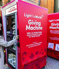 Susan Lee uses the reverse vending machine, which opened for donations on Dec. 20.
Richmond is one of 106 cities worldwide hosting a Light the World Giving Machine this
Christmas season, marking the second year of participation.