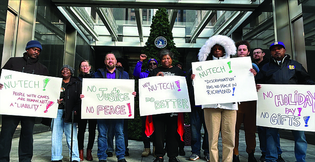 Custodians rally outside Richmond City Hall, holding picket signs to demand justice
following allegations of retaliatory firings and disability discrimination by Nu-Tech
Janitorial Services.