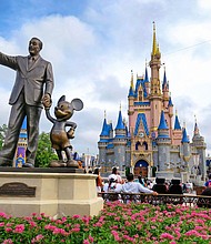 The "Partners" statue of Walt Disney and Mickey Mouse is in front of Cinderella Castle at the Magic Kingdom at Walt Disney World. Disney is making a concerted effort to add simplicity to its park offerings.
Mandatory Credit:	Joe Burbank/Orlando Sentinel/Tribune News Service/Getty Images via CNN Newsource