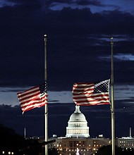 With the US Capitol in the distance, flags fly at half-staff at the Washington Monument on the National Mall following the death of former President Jimmy Carter, in Washington, DC, on December 30.
Mandatory Credit:	Kevin Lamarque/Reuters via CNN Newsource